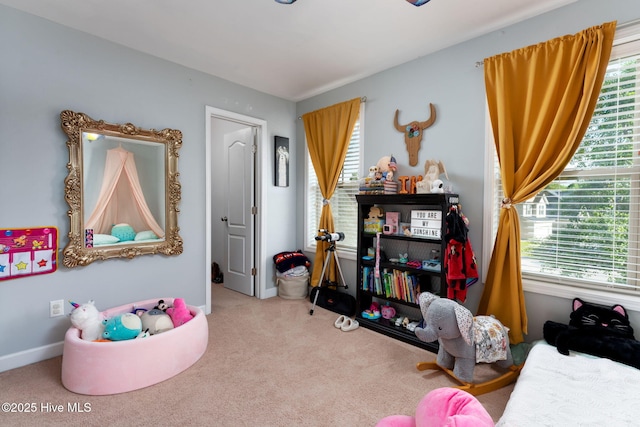 bedroom with carpet flooring and baseboards