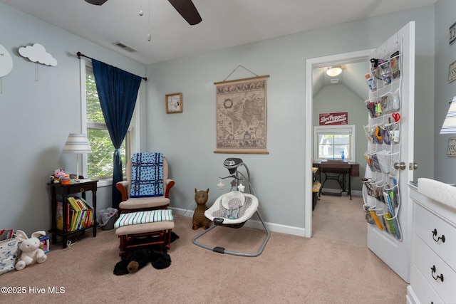 sitting room featuring visible vents, a ceiling fan, baseboards, and light carpet