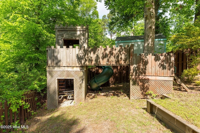 view of outdoor structure featuring fence