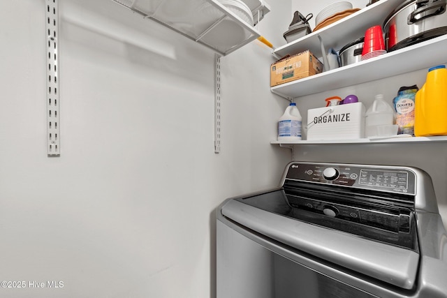 clothes washing area with laundry area and washer / clothes dryer