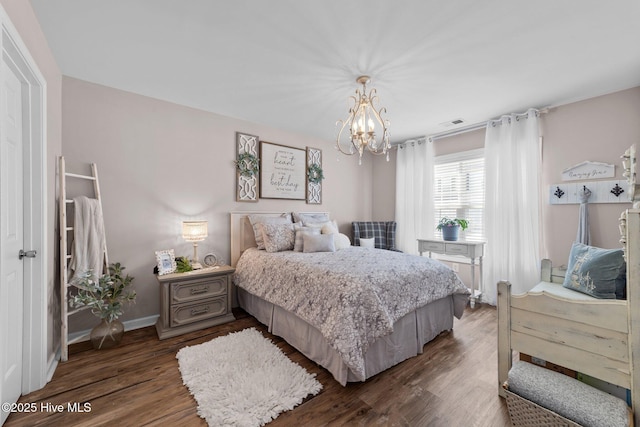bedroom featuring baseboards, a chandelier, dark wood-style floors, and visible vents