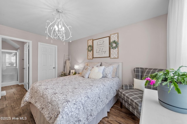 bedroom with an inviting chandelier, baseboards, and wood finished floors