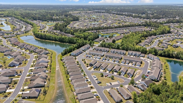 drone / aerial view featuring a water view and a residential view