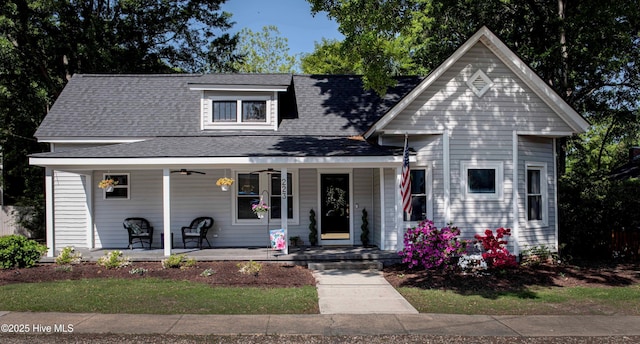 223 N Main St, Wendell, NC 27591 - view of front of home with roof with shingles, ceiling fan, and covered porch