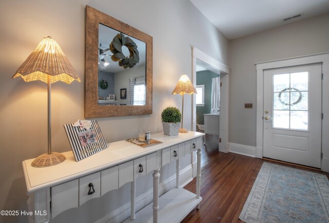 223 N Main St, Wendell, NC 27591 - entrance foyer featuring baseboards, visible vents, and dark wood-style floors