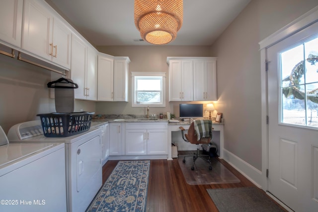 223 N Main St, Wendell, NC 27591 - clothes washing area with a sink, dark wood-type flooring, independent washer and dryer, baseboards, and cabinet space