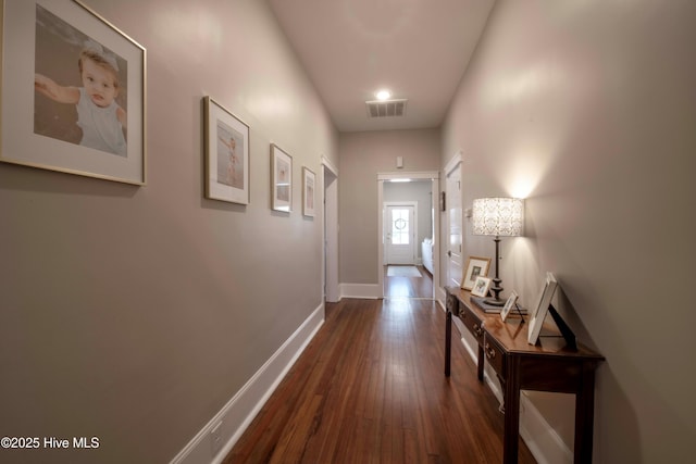 223 N Main St, Wendell, NC 27591 - hallway featuring baseboards, dark wood-style flooring, and visible vents