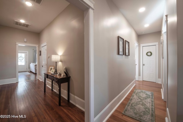 223 N Main St, Wendell, NC 27591 - hall featuring dark wood finished floors, baseboards, and visible vents