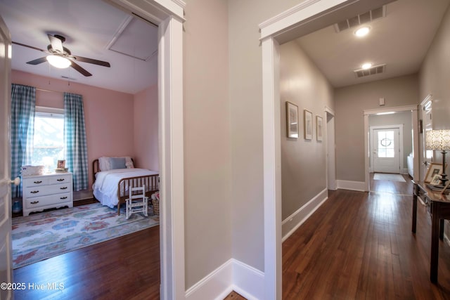 223 N Main St, Wendell, NC 27591 - hall with attic access, dark wood finished floors, baseboards, and visible vents