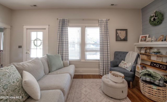 223 N Main St, Wendell, NC 27591 - living area featuring visible vents, baseboards, and wood finished floors