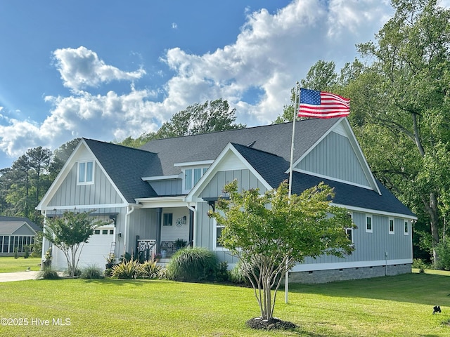 view of front of house featuring a garage, board and batten siding, a front yard, and a shingled roof