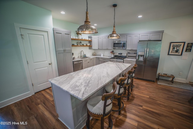 596 W Burton Farm Dr, Minnesott Beach, NC 28510 - kitchen with a sink, open shelves, stainless steel appliances, dark wood finished floors, and gray cabinets