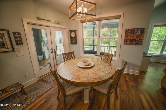 596 W Burton Farm Dr, Minnesott Beach, NC 28510 - dining room with french doors, dark wood-type flooring, baseboards, and a notable chandelier