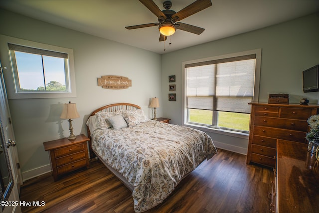 596 W Burton Farm Dr, Minnesott Beach, NC 28510 - bedroom featuring dark wood-style flooring, baseboards, and a ceiling fan