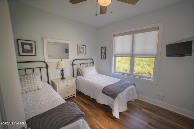 596 W Burton Farm Dr, Minnesott Beach, NC 28510 - bedroom with dark wood-type flooring, baseboards, and a ceiling fan