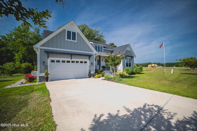 596 W Burton Farm Dr, Minnesott Beach, NC 28510 - craftsman-style house featuring an attached garage, concrete driveway, a front yard, and board and batten siding