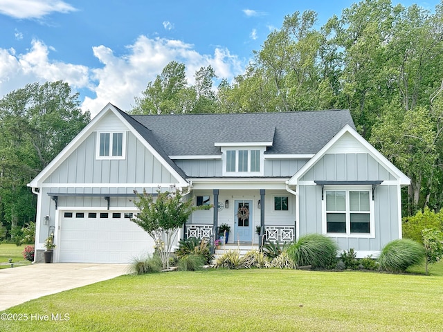 view of front of home featuring board and batten siding, an attached garage, concrete driveway, and roof with shingles