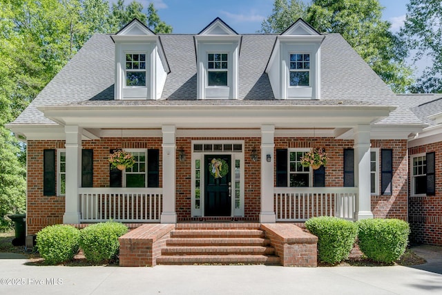 118 Legacy Oaks Dr, Wallace, NC 28466 - view of front of house featuring a porch, brick siding, and roof with shingles