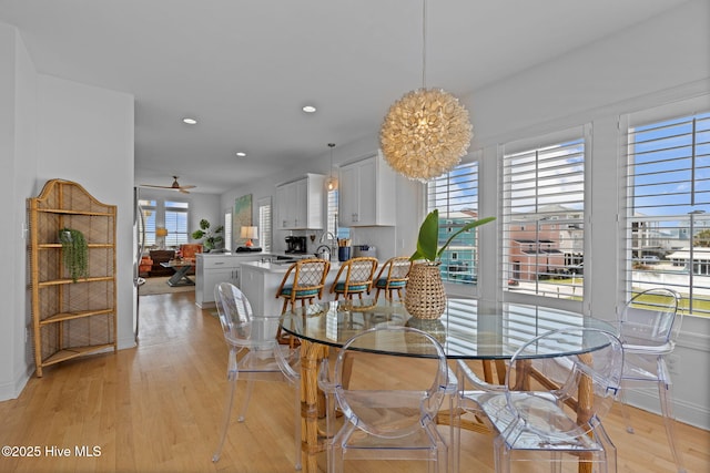 dining area featuring light wood-style floors, ceiling fan, recessed lighting, and baseboards