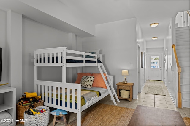 tiled bedroom with baseboards