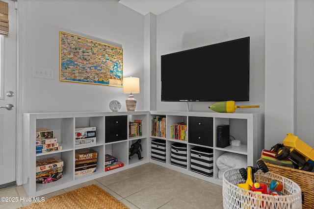 recreation room featuring tile patterned floors