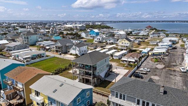 aerial perspective of suburban area featuring a large body of water