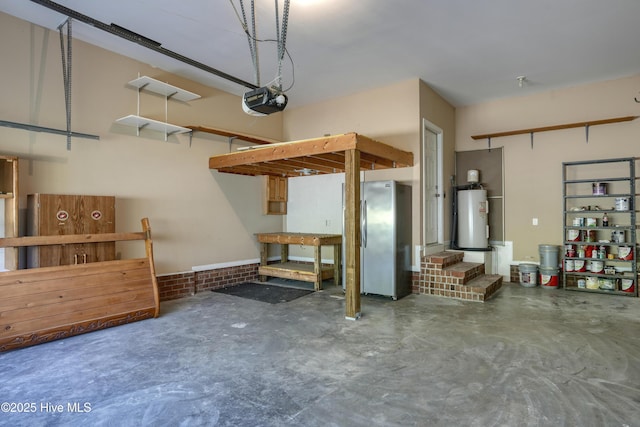 garage with freestanding refrigerator, a garage door opener, and water heater