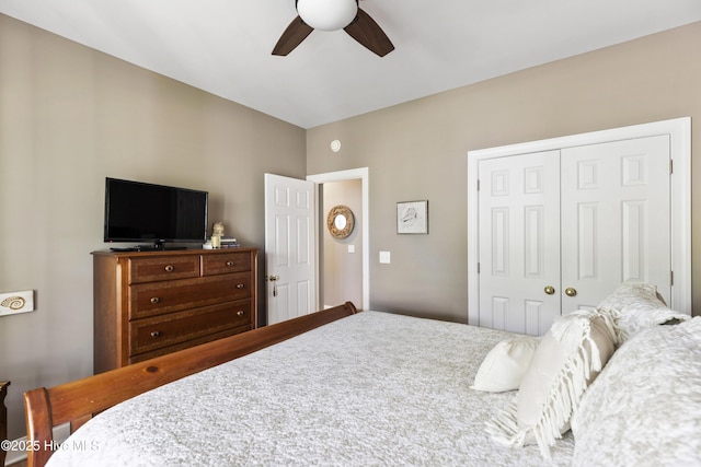 bedroom featuring ceiling fan and a closet