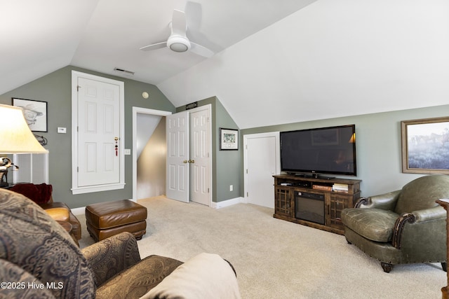 carpeted living area with baseboards, ceiling fan, vaulted ceiling, and visible vents