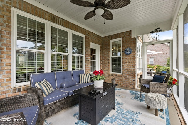 sunroom featuring ceiling fan and outdoor lounge area