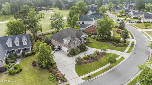 bird's eye view with a residential view and view of golf course