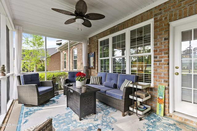 sunroom / solarium featuring an outdoor hangout area and ceiling fan