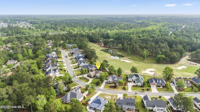 aerial view featuring a forest view, a water view, a residential view, and golf course view