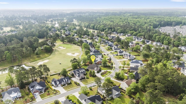 drone / aerial view featuring a residential view and golf course view