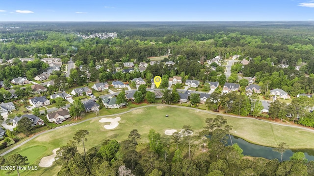 bird's eye view with a water view, view of golf course, a residential view, and a forest view