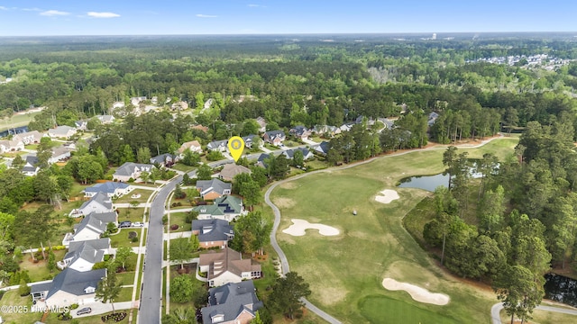aerial view featuring a water view, golf course view, a residential view, and a forest view