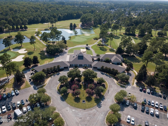 birds eye view of property with a water view and golf course view