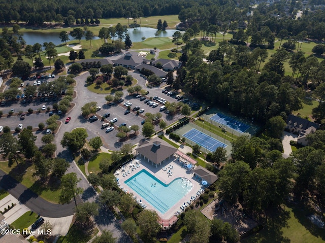 drone / aerial view with a water view and golf course view