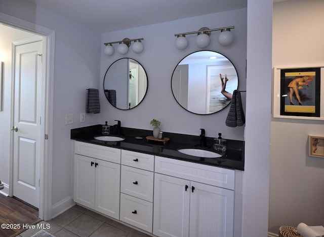 3100 Marsh Grove Ln Unit 3212, Southport, NC 28461 - bathroom featuring double vanity, tile patterned flooring, and baseboards