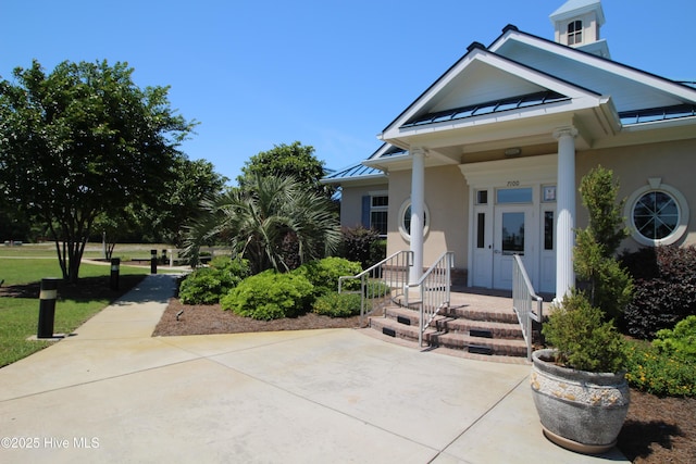 3100 Marsh Grove Ln Unit 3212, Southport, NC 28461 - view of front facade with a standing seam roof, stucco siding, and metal roof