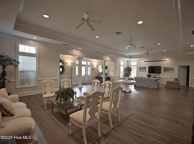3100 Marsh Grove Ln Unit 3212, Southport, NC 28461 - dining area featuring a tray ceiling, a ceiling fan, ornamental molding, dark wood-style floors, and a wainscoted wall