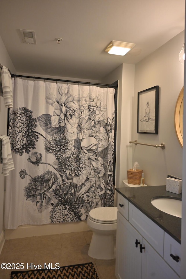 3100 Marsh Grove Ln Unit 3212, Southport, NC 28461 - full bath with vanity, toilet, tile patterned floors, and a shower with shower curtain