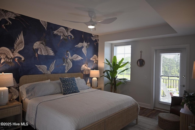 3100 Marsh Grove Ln Unit 3212, Southport, NC 28461 - bedroom featuring access to exterior, baseboards, wood finished floors, and ceiling fan