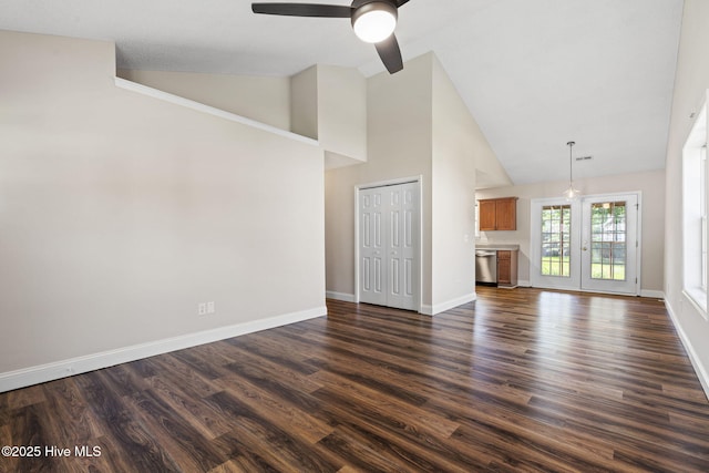 719 Oak Branches Close Close SE, Leland, NC 28451 - unfurnished living room with a ceiling fan, dark wood-style floors, high vaulted ceiling, and baseboards