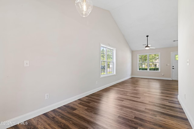 719 Oak Branches Close Close SE, Leland, NC 28451 - spare room with ceiling fan, baseboards, dark wood-type flooring, and high vaulted ceiling