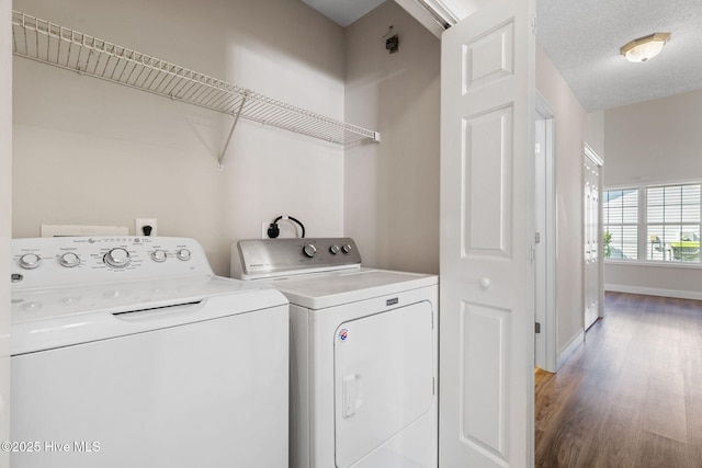719 Oak Branches Close Close SE, Leland, NC 28451 - laundry room featuring washer and dryer, wood finished floors, and baseboards