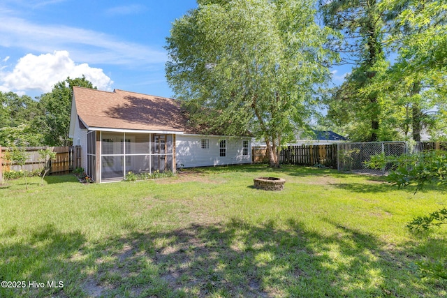719 Oak Branches Close Close SE, Leland, NC 28451 - view of yard with an outdoor fire pit and a sunroom
