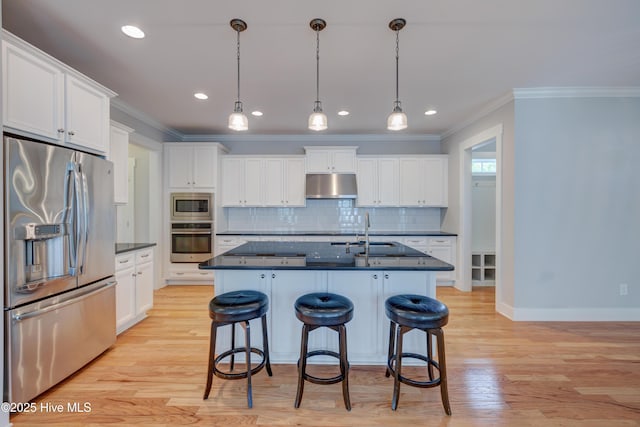 1012 Anchors Bend Way, Wilmington, NC 28411 - kitchen featuring crown molding, dark countertops, appliances with stainless steel finishes, and under cabinet range hood