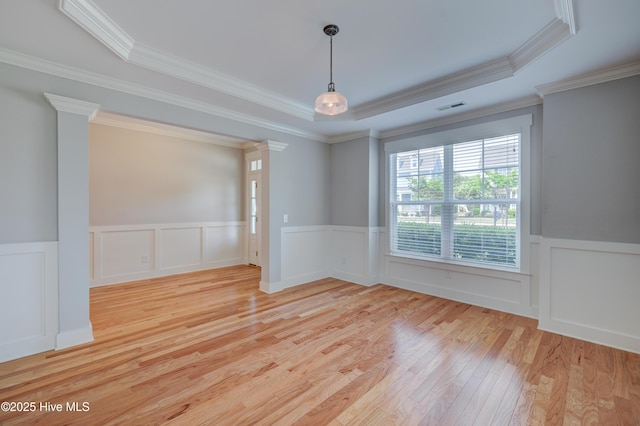 1012 Anchors Bend Way, Wilmington, NC 28411 - unfurnished room with crown molding, a wainscoted wall, visible vents, and hardwood / wood-style floors