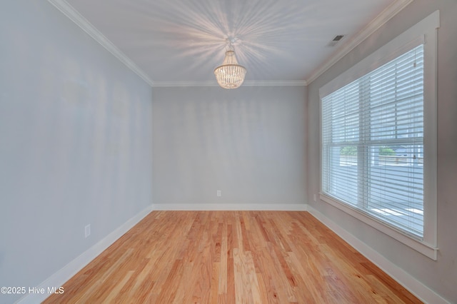 1012 Anchors Bend Way, Wilmington, NC 28411 - unfurnished room featuring crown molding, wood finished floors, a chandelier, and baseboards